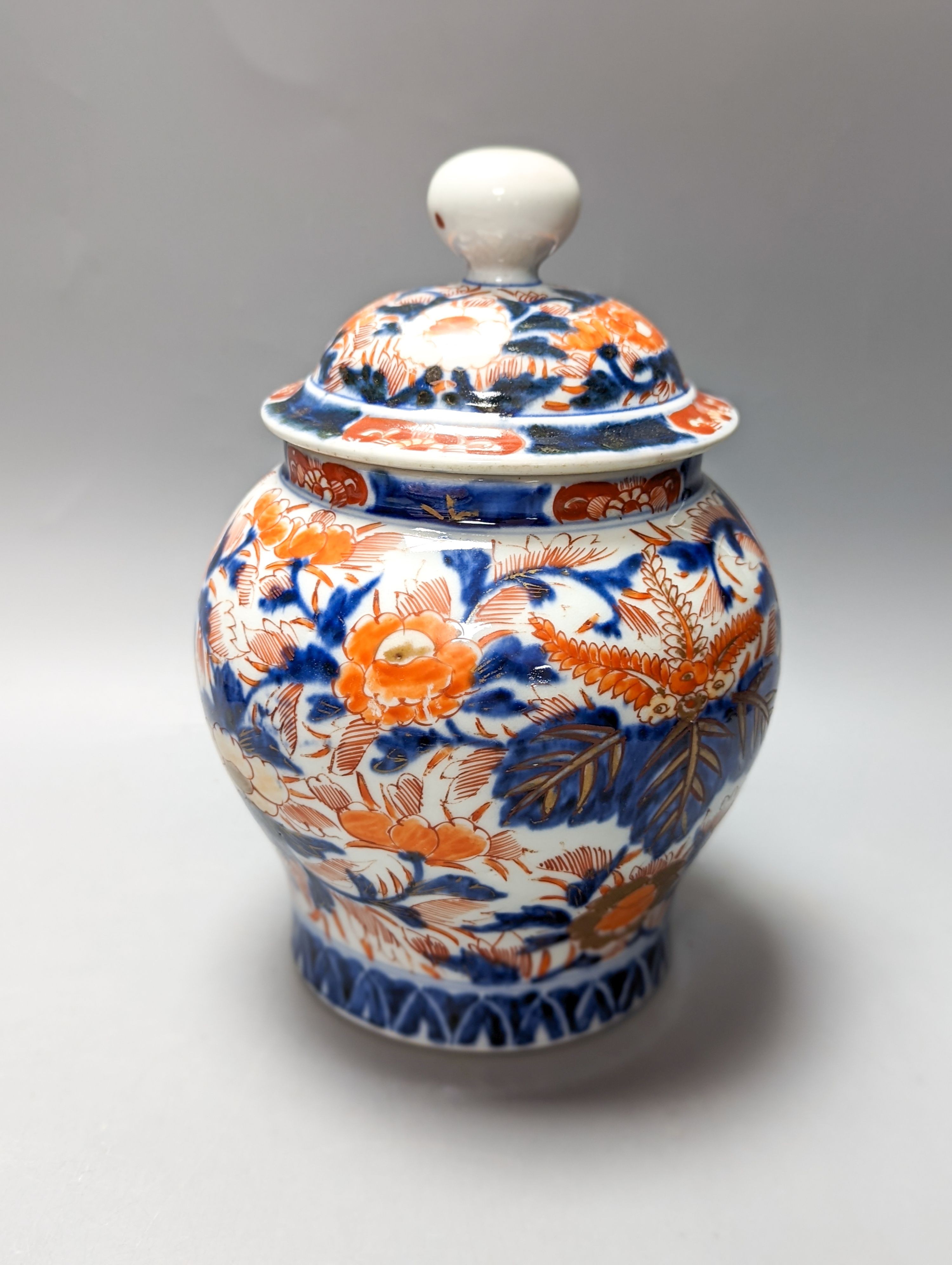 A 19th century Chinese porcelain bowl, transfer printed pillow, a Japanese Imari jar and cover and three Imari plates 21cm